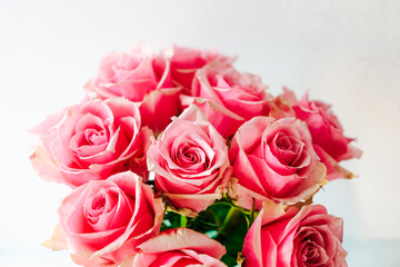 Roses in a delicate arrangement for a romantic occasion showcasing pink petals and verdant stems