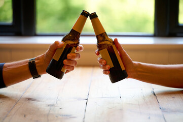 Cheers with Generic Beer Bottles