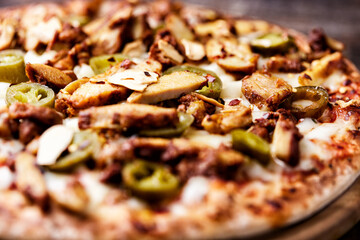 Gyros Pizza with jalapeno pepper and mozzarella cheese. Soft focus. Close up.	