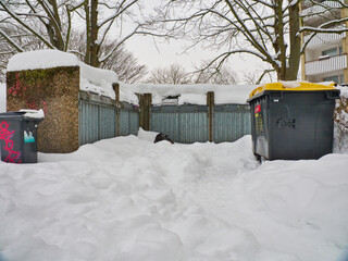 Trash cans covered in snow