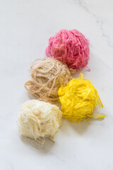 Traditional Turkish sweet. Pismaniye. Light halva, sweet cotton in the form of threads in a ball. With the aroma of melon, vanilla, chocolate, pomegranate. White background. Close up