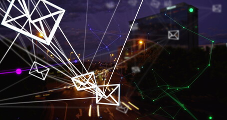 Streaming envelope icons with connecting lines over urban highway at night, with email data