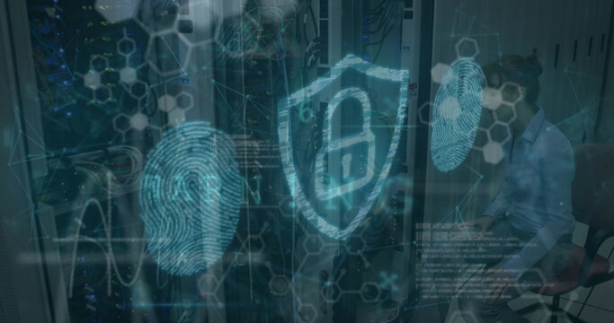 Technician reviewing tablet near racks in data center, viewing shield icon with fingerprint icons