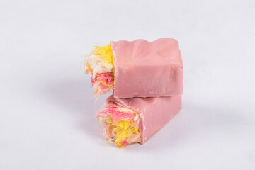 Angel Hair. Modern Raspberry white chocolate candy bar. With colored cotton candy. White background. 