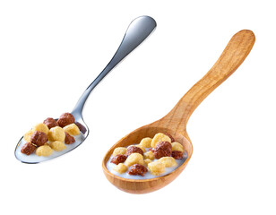 corn balls and chocolate balls with milk in a metal spoon isolated on white background.