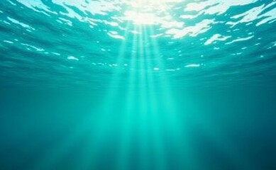 Fototapeta premium Half underwater view showing surface of turquoise sea with sun reflections