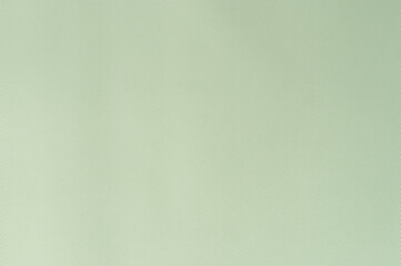 Soft green fabric background creates calm and serene atmosphere in interior design