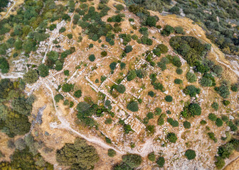 Aerial view of the archaeological site of the civilization, surrounded by vegetation on a hill