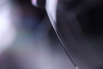 Gray glossy liquid, dark minimalistic background, melted aluminium surface, liquid glass effects