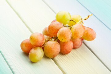 red grape on wood background