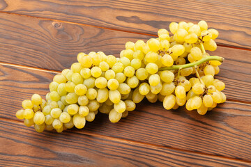 sultana seedless grape on brown wood background
