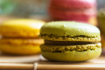 Colorful Assortment of Macarons in Various Flavors on a Wooden Surface