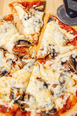 Gourmet homemade mushroom pizza with stretchy mozzarella. whole wheat pizza dough.