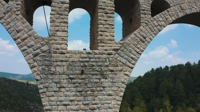 The Varda bridge. The engineering mastery of the massive main arches that carry the railway's load, and the layered auxiliary arches that support them, is revealed in this cinematic shot.