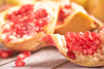 Pomegranates close up, Details of beautiful pomegranates on rustic wood with abstract background,...