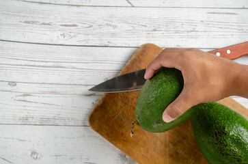 Fresh Avocados on Rustic Wooden Background – Organic Food Concept. Fresh palta  on Rustic Wooden...
