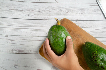 Fresh Avocados on Rustic Wooden Background – Organic Food Concept. Fresh palta  on Rustic Wooden...