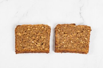 Vegan whole grain bread with sunflower seeds. Close-up