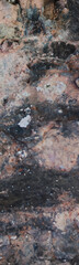 Dark vertical shot of eroded rock texture backdrop.Ideal for use in design, 3D modeling, game environments, and architectural backgrounds.High quality. Copy space. 