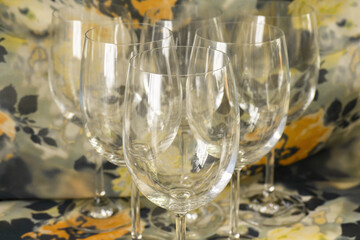 Several glass goblets stand beautifully on the table