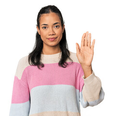 Young Filipina woman smiling cheerful showing number five with fingers.