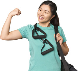 Chinese athlete using resistance bands raising fist after a victory, winner concept.
