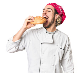 Young Caucasian chef with artisanal bread in studio