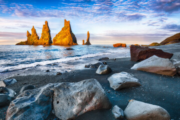 Impressive landscape with basalt rock formations Troll Toes on Black beach Reynisfjara near the...