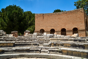 Fragment of a stone amphitheater in the ruins of the ancient Roman city of Gortyna on the island of...
