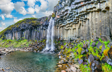 Ramarkable view of Svartifoss waterfall with basalt columns on southern part of Iceland.