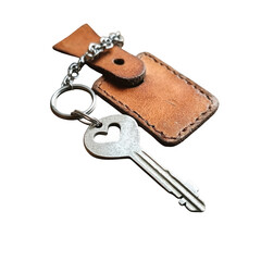 Metal key with leather tag isolated on transparent background
