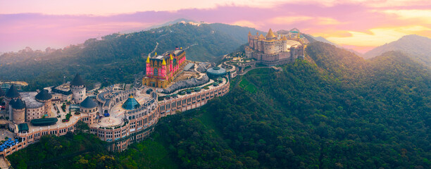 Ba na hills scenic view, vibrant architecture lunar castles and French village and lush greenery in...