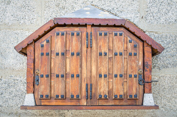 Wooden box on a building facade
