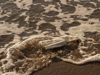 Message in a Bottle on Shoreline Waves