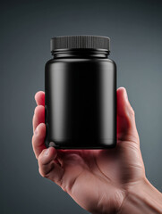 Small hand presents a sleek black container against a dark backdrop