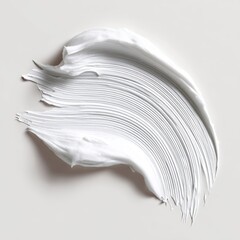 Creamy white substance swirled and smeared on a light beige background, creating a textured, elegant, and slightly abstract shape
