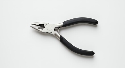 Obraz premium Black and silver pliers on white background