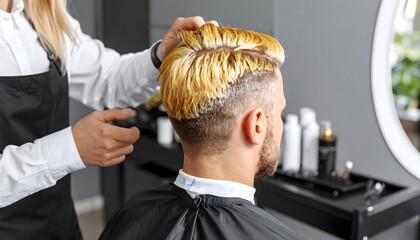 Young Man Undergoing Professional Hair Coloring Treatment for a Bold New Look in a Salon