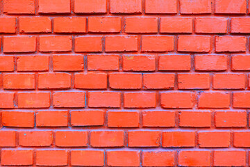 Background of uniform brick wall. Consistent pattern of the bricks creates a strong visual texture....