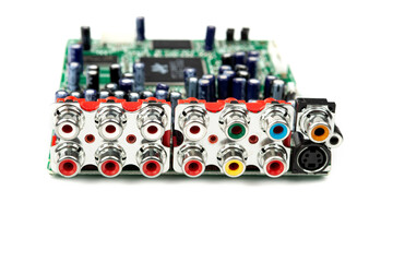 A large group of acoustic connectors on a printed circuit board, equipped with a powerful chip.