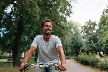 Man riding a bicycle in a park
