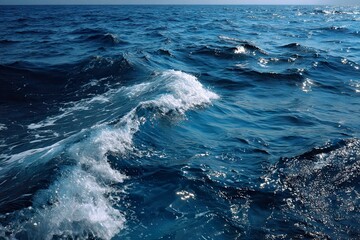 Dark blue sea surface with rolling waves