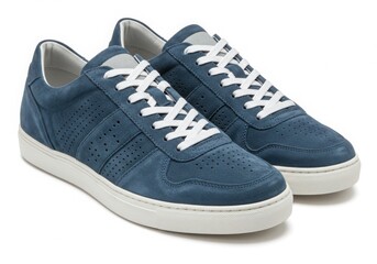 Blue suede sneakers with white laces isolated on white background