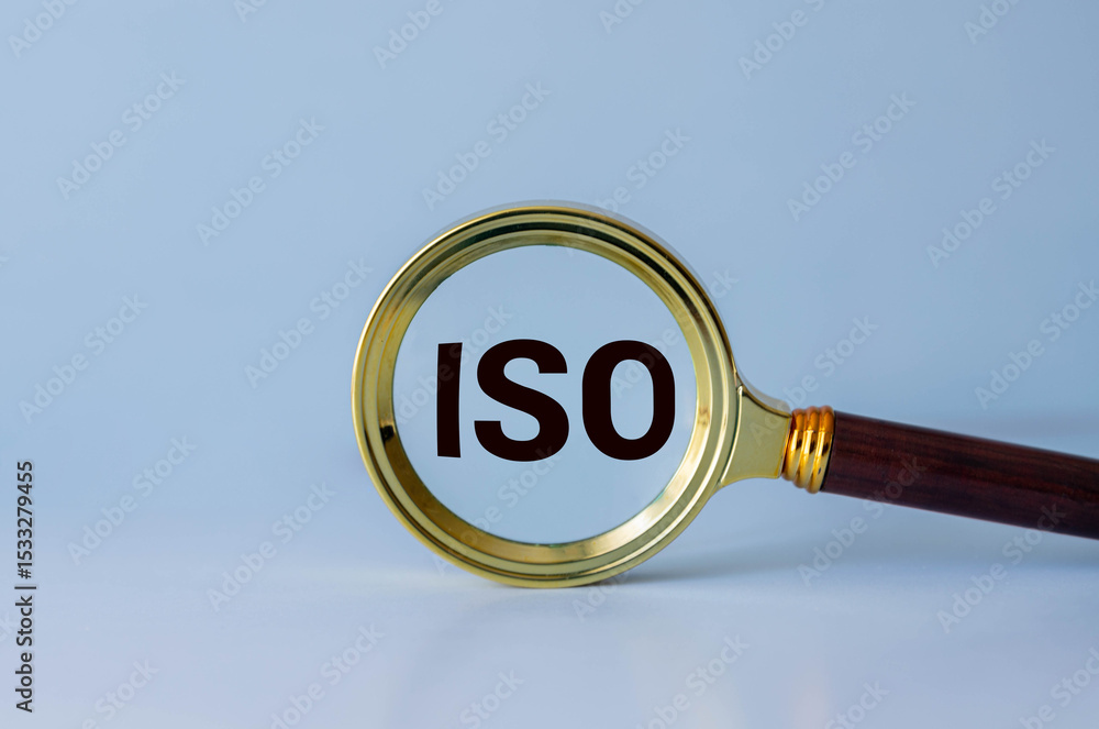 Poster a magnifying glass is used to magnify the word iso, highlighting its importance in standardization a