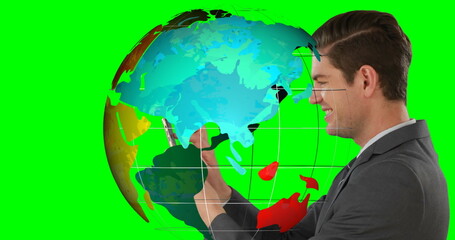 Manipulating businessman holding smartphone in green screen, with digital globe overlay, copy space