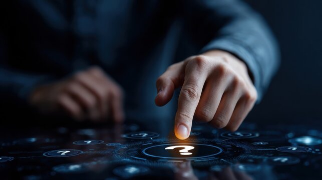 A hand pointing at a question mark on a screen