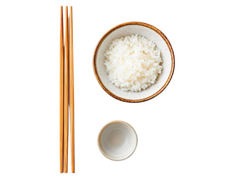 Overhead view of cooked white rice in a bowl, wooden chopsticks, and a small empty bowl, transparent background