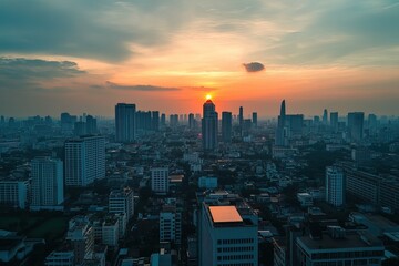 Fototapeta premium Photograph of a rooftop solar panel installation on the roof of an office building in Bangkok, with skyscrapers and cityscape in the background at sunset stainable energy practices for green business