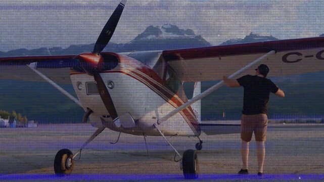 Aviation pilot arriving airstrip starting preflight check inspecting plane wing and cockpit