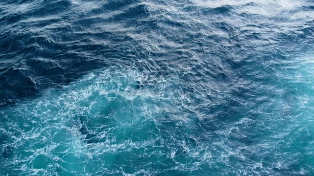 Immerse in the serene beauty of gentle ocean waves, showcasing stunning blues and dynamic movement. Perfect for nature and waterthemed projects, this scene captures coastal bliss